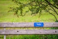 Wooden bench with touristic promotional sign in Nauders Tyrol, Austria