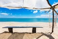 Wooden bench under a shed on the beach