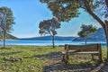 A wooden bench with a view on the sea and the beautiful nature