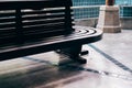 Wooden bench waiting chair at railway train station Royalty Free Stock Photo