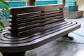 Wooden bench waiting chair at railway train station Royalty Free Stock Photo