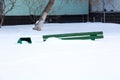 Wooden bench in winter under the snow, inaction of snow blowers in the snowfall Royalty Free Stock Photo