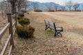 Wooden benches at edge of field