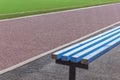 Wooden benches for fans on soccer football field