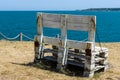 Wooden benches on the high seashore.