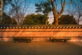 Wooden benches with Korean traditional walls at sunset in South Korea