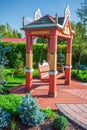 Wooden big swing in garden Royalty Free Stock Photo