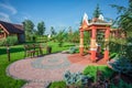 Wooden big swing in garden Royalty Free Stock Photo