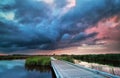 Wooden bike road on water and storm