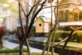 Wooden bird house in the city. Illustration for Real Estate or Construction. House rent concept. Royalty Free Stock Photo