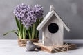 Wooden bird house near the potted hyacinth flower. Generate ai