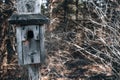 Wooden bird house on a post Royalty Free Stock Photo