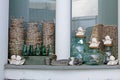 Wooden birds, wicker baskets, ceramic angels, flowerpots, glass bottles and jars in flower shops Royalty Free Stock Photo
