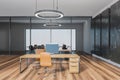 Wooden black office room with chairs and computers on parquet floor