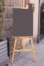 Blackboard in front of restaurant entrance. Mock up menu blank board sign stand near shop or cafe restaurant. Street Royalty Free Stock Photo