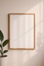 Minimalist Blank Frame on Neutral Wall in Natural Light Royalty Free Stock Photo
