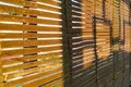 Wooden blinds in the afternoon sun Royalty Free Stock Photo