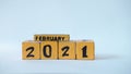 Wooden block calendar with a focus on February 2021
