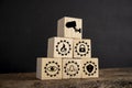 Wooden block with CCTV concept symbols on black background