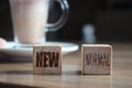 Wooden block cubes for new normal wording. The world is changing to balance it into new normal include business , economy , Royalty Free Stock Photo