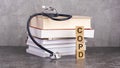 wooden block form the word COPD with stethoscope on the doctor's desktop. medical concept. concept of medical Royalty Free Stock Photo