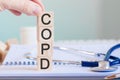 wooden block form the word copd with stethoscope on the doctor& x27;s desktop, medical concept Royalty Free Stock Photo