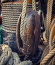 Wooden block and ropes on the background of the mast of the sailing ship Royalty Free Stock Photo