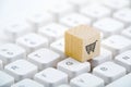 Wooden block with shopping cart graphic on computer keyboard. Online shopping concept. Royalty Free Stock Photo