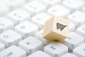 Wooden block with shopping cart graphic on computer keyboard. Royalty Free Stock Photo