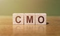 Wooden Block Spelling the Word CMO Royalty Free Stock Photo
