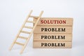 Wooden block with text, problem and solutions. Solutions to problems concept