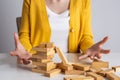 Wooden block and tower collapses, Management of risks and economic instability concept