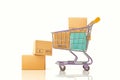 Wooden block with trolley and paper boxes symbolize shopping success