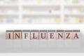 Wooden block with the word Influenza on a white background Royalty Free Stock Photo