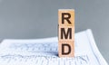 Wooden block with words RMD - acronim RMD - Required Minimum Distributions. Concept image of Accounting Business Acronym RMD Royalty Free Stock Photo