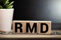 wooden block with words RMD required minimum distributions Royalty Free Stock Photo