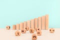 Wooden blocks as increasing graph bar. Dice stack on white table. Concept for business risk, chance, or growth Royalty Free Stock Photo