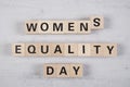 wooden blocks building the word womens equality day Royalty Free Stock Photo