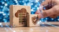 Wooden blocks with cloud computing and security concepts with digital effects in the background Royalty Free Stock Photo