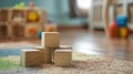 Wooden blocks on a colorful carpet in a room with toys in the background Royalty Free Stock Photo