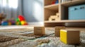 Wooden blocks on a colorful carpet in a room with toys in the background Royalty Free Stock Photo