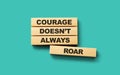 Wooden blocks Courage doesn\'t always roar word 3d illustration