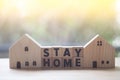 Wooden blocks cube wording of STAY HOME with wooden toy home