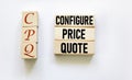 Wooden blocks and cubes with text CPQ Configure Price Quote on white background