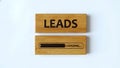 Wooden blocks displaying \'LEADS\' and a loading bar with \'LOADING...\' text, representing Royalty Free Stock Photo