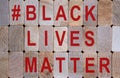 Wooden blocks form the words `blacklivesmatter`. Beautiful wooden background. Concept image