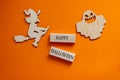 Wooden blocks form the words `happy halloween`. Wooden witch and ghost. Beautiful wooden background. Celebrate concept Royalty Free Stock Photo