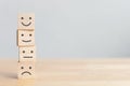 Wooden blocks with icon happy face smile symbol on wood table