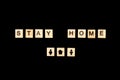 Wooden blocks with letters on black background. Stay home concept. Stop coronavirus concept. Social distancing. People at home. Fa