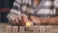 Wooden blocks with light bulbs and yellow color icons and copy space. Creative idea, solution, and innovation concept. Idea Royalty Free Stock Photo